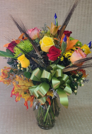 Fabulous Fall Arrangement Vase with Roses, mixed flowers and wheat.