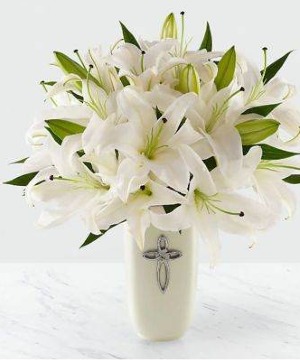 Faithful Blessing   FAITHFUL BLESSINGS BOUQUET The  Blessings Bouquet is an incredible way to celebrate a communion, confirmation, or wedding, as well as send your sympathy for the loss of a loved one. Bringing together stems of fragrant Oriental Lilies, boasting multiple blooms on each stem to create a full and lush flower bouquet, this offering of flowers will bring peace and beauty to any of life's special moments and occasions. Presented in a keepsake designer white ceramic vase with a stunning cross on the front, this exquisite flower arrangement exudes heartfelt blessings with each eye–catching, star–shaped lily.