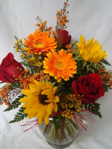 A Fall Favorite!! Roses, Gerbera daisies and  Sunflowers arranged with filler!