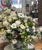 Falling Petals This is a Designer’s Choice arrangement. Flower types and colors will vary based on availability. For a custom design, please call the shop—we’d love to create something just for you! 603-279-1474
