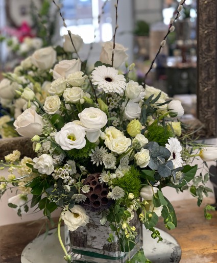 Falling Petals This is a Designer’s Choice arrangement. Flower types and colors will vary based on availability. For a custom design, please call the shop—we’d love to create something just for you! 603-279-1474