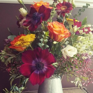 farmhouse beauty mixed flowers in galvinized pitcher