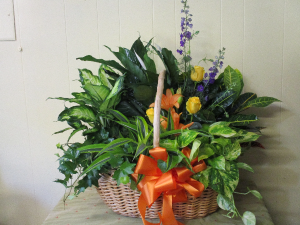 Floor Planter basket with large plants and vase of flowers