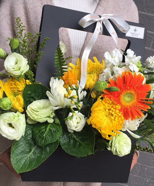 flower arrangement in an open box Arrangement