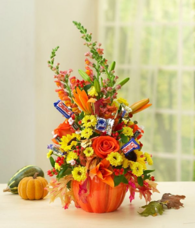 FLOWERS AND TREATS PUMPKIN ARRANGEMENT