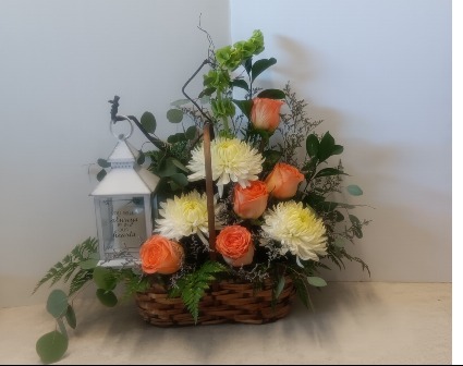 Forever in our hearts fresh floral arrangement with a battery lantern