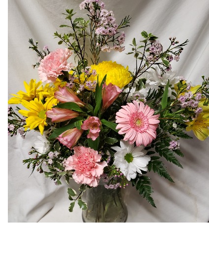 GARDEN LOOK ARRANGEMENT FOR TAKE HOME after service. Mixture of seasonal flowers in stock.