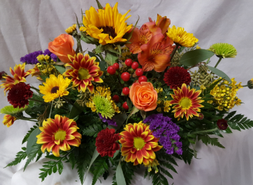 Fall Centerpiece with Seasonal bright flowers.