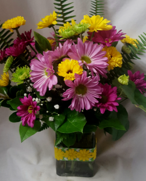 "Colorful Daisy Bouquet"...purple, lavender,  Yellow with lime green poms all arranged in a cute ribbon detailed rectangular vase with filler!