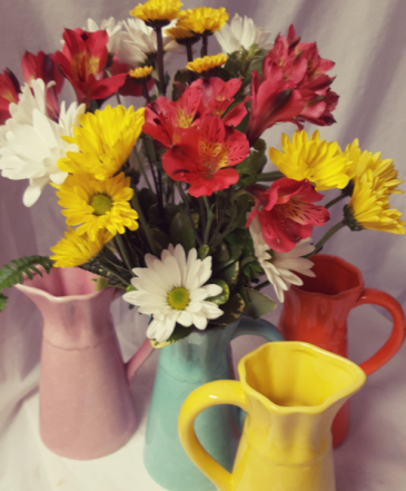 Summer Charm Bouquet...Seasonal flowers...daisies, Alstramaria lilies,arranged in a bright keepsake pitcher.