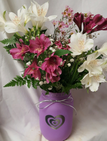 Heart Mason Jar filled with alstramaria lilies And fillers (colors of heart mason jar and Alstramaria Lillies may vary)