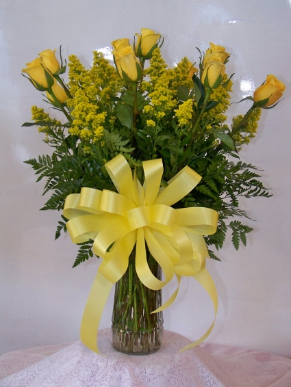 Gold Stripe Roses Classic dozen roses in vase with filler, greens, and a bow. 
