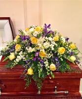 Golden sunset casket spray