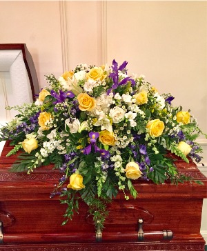 Golden sunset casket spray