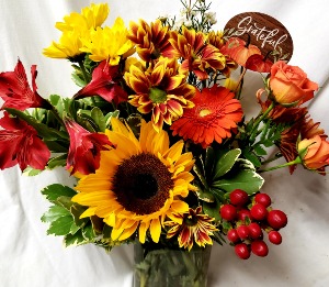 "Grateful arrangement"...mixed bright seasonal Fall flowers in a vase with either a GRATEFUL OR THANKFUL PICK!