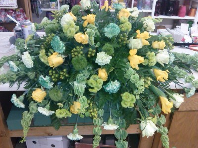Green and yellows Casket Spray