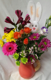Raffia wrapped handle Pitcher filled with bright Seasonal flowers and Easter Pic. Nice ceramic keepsake container...May come in different color if Orange is sold out.