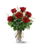 Half dozen red roses in a vase 