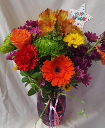 HAPPY BIRTHDAY CELEBRATION BOUQUET...Colored vase  with colorful seasonal flowers arranged with a Happy Birthday Pick!!