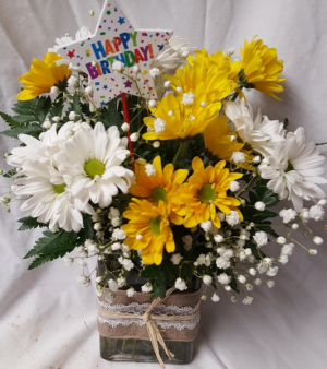 Happy Birthday Daisy arrangement. Yellow and White daisies arranged in a cute ribbon detailed rectangular vase with baby's breath and Happy Birthday Pic!