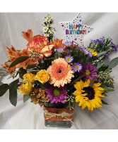 HAPPY BIRTHDAY FLING...fall bright flowers  Arranged with seasonal filler and happy birthday pick! FALL FABRIC ON RECTANGLE VASE 
