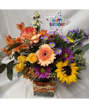 HAPPY BIRTHDAY FLING...fall bright flowers  Arranged with seasonal filler and happy birthday pick! FALL FABRIC ON RECTANGLE VASE 
