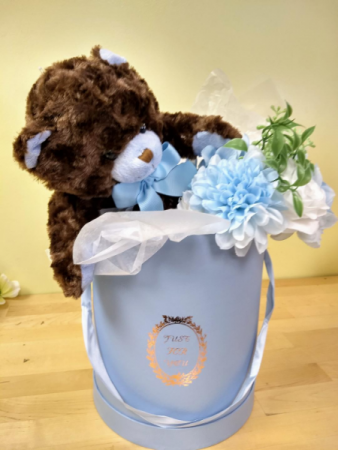 hat box with brown a Teddy and silk flower bouquet
