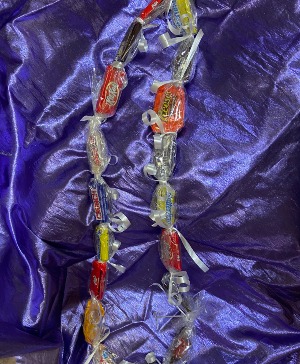 have a sweet graduation candy lei  perfect to say congrats