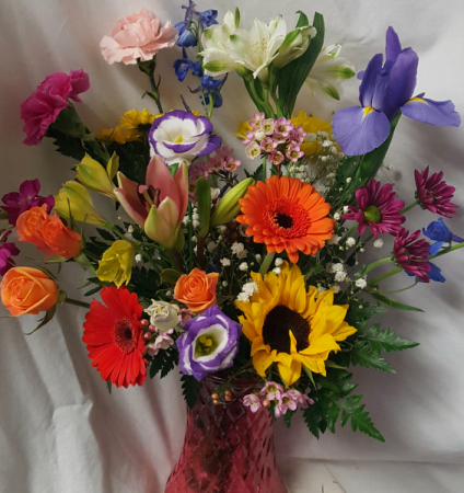 SWEET SPRING BOUQUET...seasonal bright mixed Flowers in a colored vase!