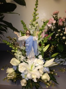 He is risen. blue and white with Christ Statuette