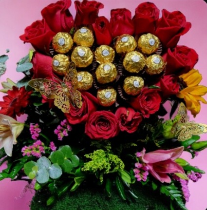 Heart shaped box with roses and chocolates  