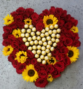 Heart with red roses, sunflowers and chocolates 