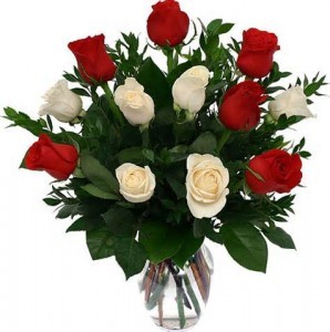 Dozen Red and White Roses arrranged in a vase. 