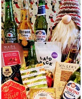 A GNOMOUS HOLIDAY CHEERS. A baskets of beers and savoury treats