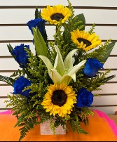 Tu Cara Bonita blue roses and sunflowers