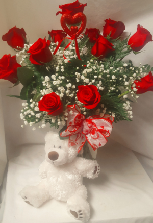'HUGS AND KISSES' DOZEN RED ROSES ARRANGED IN A  vase with baby's breath and a white medium bear!!