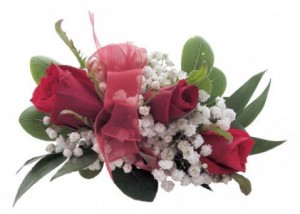 3 red sweetheart roses with baby's breath with a  wristband and red ribbon or choose your own color ribbon