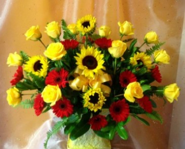 Bright shades of yellows and reds arranged flowers