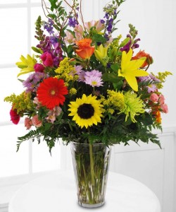 MEMORABLE TRIBUTE Bright Seasonal flowers arranged