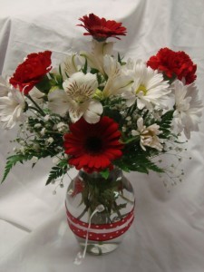 Cute vase with red and white polka dot ribbon and red and white flowers!!