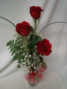 "True Love" 3 Red Roses in a bud vase with filler  and tulle bow.