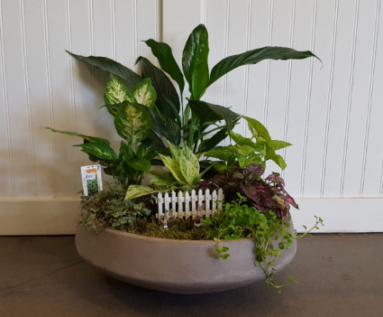 Large cement planter with fence and mini rabbits planter