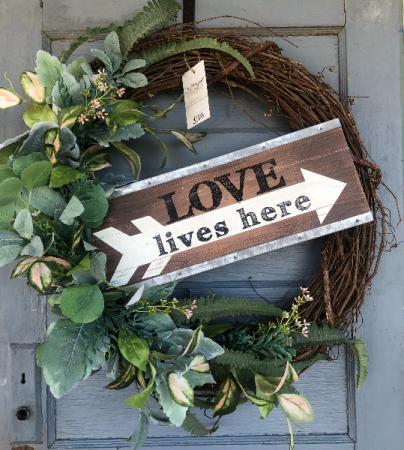 Large “Love Lives Here” wreath with greenery