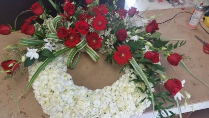 Large Sympathy wreath Lush wreath of white hydranga's Red roses and red Gerbera's