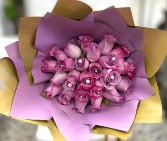 Lavender roses in lavender paper