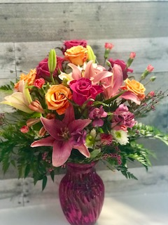 Light My Fire Pink lilies, colorful roses,mini carns, fillers
