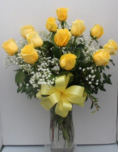 Long stemmed Yellow Roses Arranged in Glass Vase