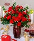 LOVE BLOSSOMS BOUQUET Red Arrangement in Red Swirl Vase