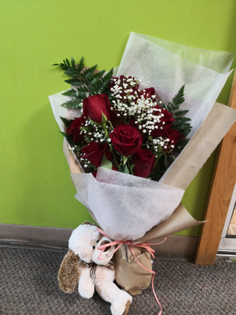 Love me? One dozen red roses with baby breath wrapped