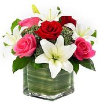 Lovely Lily and Rose Romance Includes red and pink roses, white lilies and a square glass vase